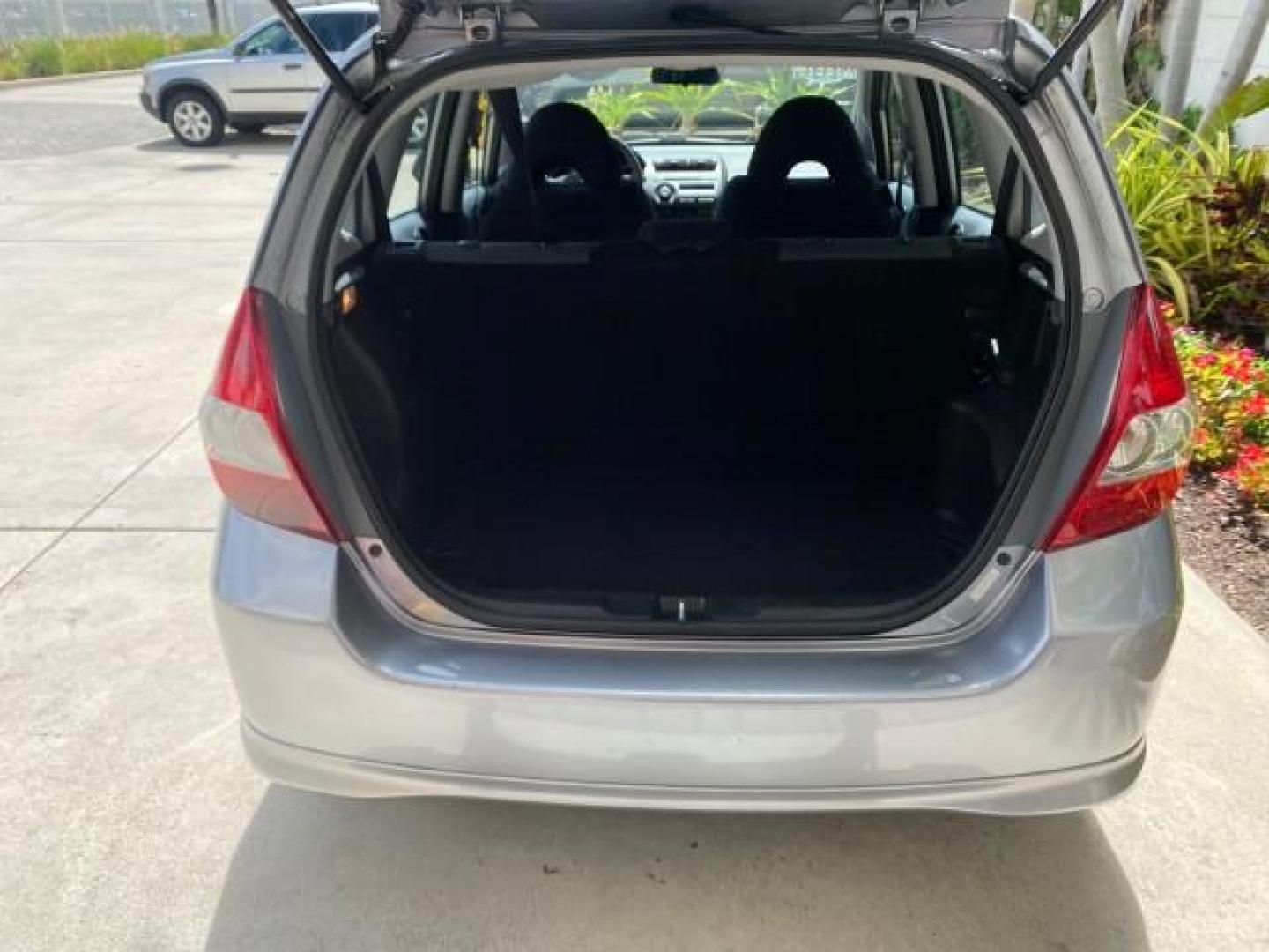 2007 Storm Silver Metallic /Black Honda Fit FIT Sport 1 OWNER LOW MILES 22,306 (JHMGD38607S) with an 1.5L SOHC PGM-FI 16-Valve VTEC I4 Engine engine, Automatic transmission, located at 4701 North Dixie Hwy, Pompano Beach, FL, 33064, (954) 422-2889, 26.240938, -80.123474 - OUR WEBPAGE FLORIDACARS1.COM HAS OVER 100 PHOTOS AND FREE CARFAX LINK 2007 Honda Fit Sport 1 OWNER Hatchback 4 DR 1.5L I4 F SOHC Gasoline 37 MPG Front Wheel Drive Features ABS Brakes Air Conditioning Alloy Wheels AM/FM Stereo Automatic Transmission Auxiliary Audio Input CD Audio Cloth Seats Cruise C- Photo#88