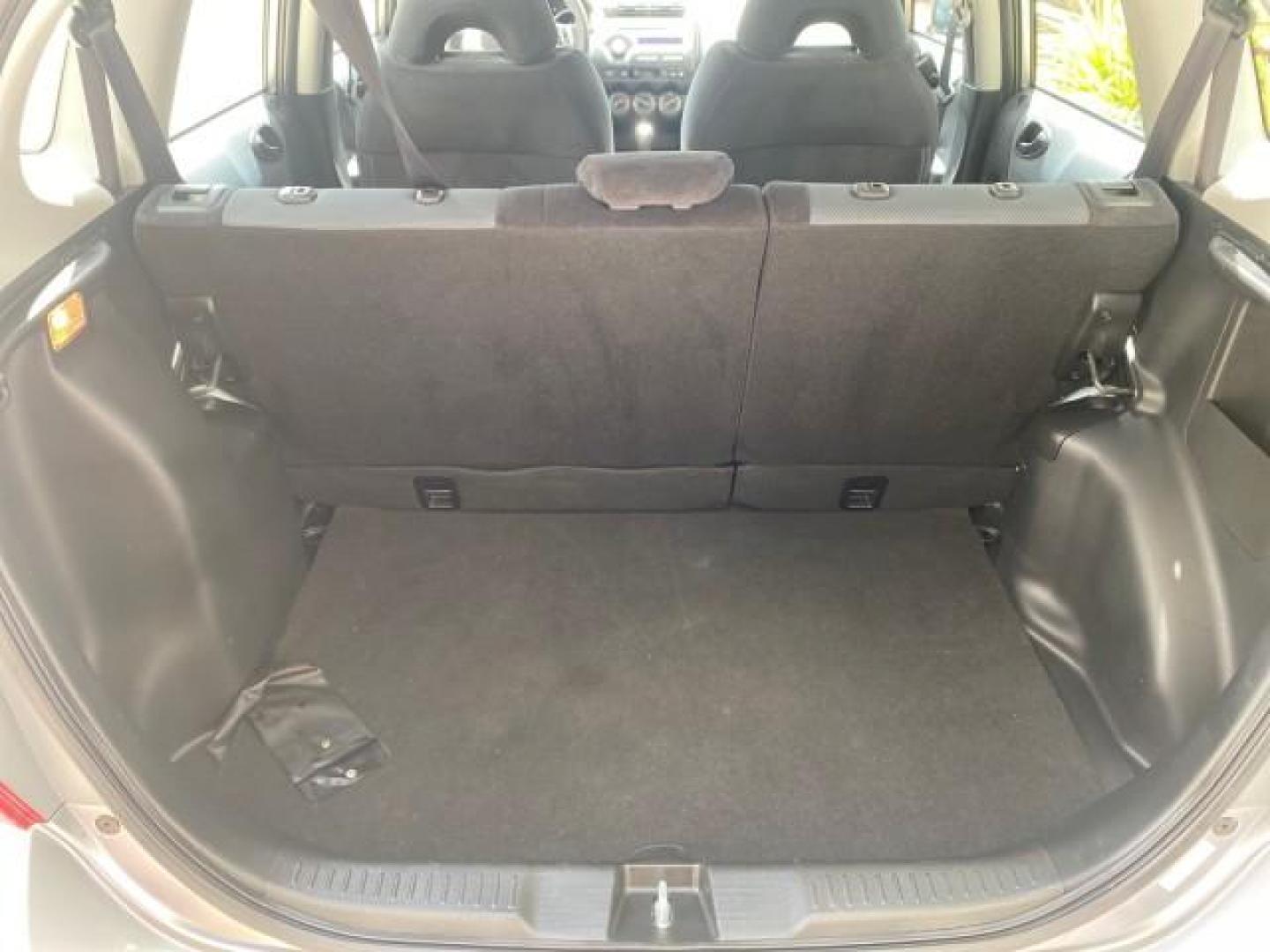 2007 Storm Silver Metallic /Black Honda Fit FIT Sport 1 OWNER LOW MILES 22,306 (JHMGD38607S) with an 1.5L SOHC PGM-FI 16-Valve VTEC I4 Engine engine, Automatic transmission, located at 4701 North Dixie Hwy, Pompano Beach, FL, 33064, (954) 422-2889, 26.240938, -80.123474 - OUR WEBPAGE FLORIDACARS1.COM HAS OVER 100 PHOTOS AND FREE CARFAX LINK 2007 Honda Fit Sport 1 OWNER Hatchback 4 DR 1.5L I4 F SOHC Gasoline 37 MPG Front Wheel Drive Features ABS Brakes Air Conditioning Alloy Wheels AM/FM Stereo Automatic Transmission Auxiliary Audio Input CD Audio Cloth Seats Cruise C- Photo#93