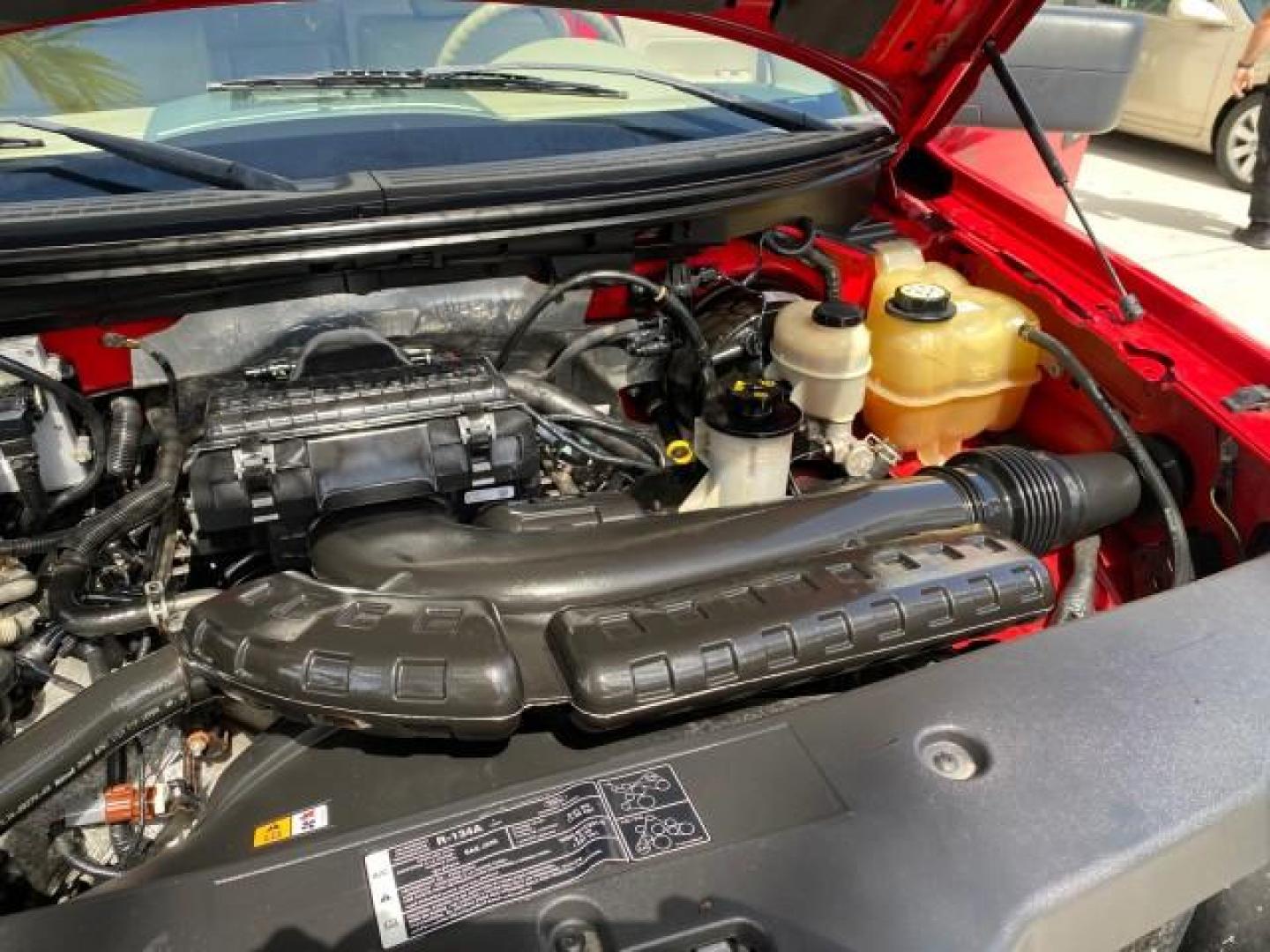 2007 Bright Red /Tan Ford F-150 Lariat 4WD LEATHER LOW MILES 80,286 (1FTPX14V97N) with an 5.4L 24-Valve EFI FFV V8 Engine engine, Automatic transmission, located at 4701 North Dixie Hwy, Pompano Beach, FL, 33064, (954) 422-2889, 26.240938, -80.123474 - OUR WEBPAGE FLORIDACARS1.COM HAS OVER 100 PHOTOS AND FREE CARFAX LINK 2007 Ford F-150 Lariat 4 Door Extended Cab Pickup 5.4L V8 F SOHC Flex Fuel 18 MPG Rear Wheel Drive w/ 4X4 Features 20 Inch Plus Wheels 4WD/AWD ABS Brakes Air Conditioning Alloy Wheels AM/FM Stereo Automatic Transmission Auxiliary- Photo#25
