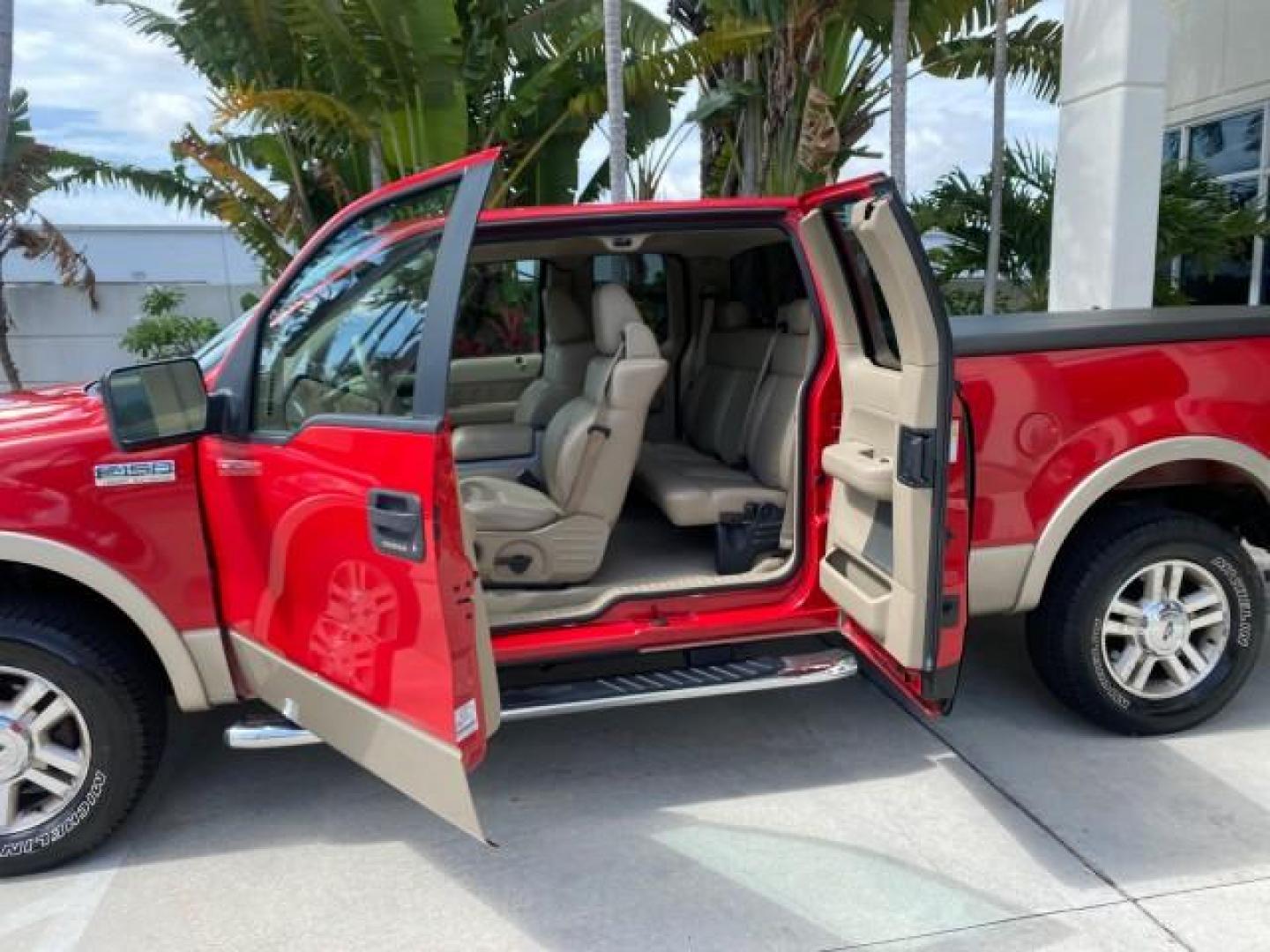 2007 Bright Red /Tan Ford F-150 Lariat 4WD LEATHER LOW MILES 80,286 (1FTPX14V97N) with an 5.4L 24-Valve EFI FFV V8 Engine engine, Automatic transmission, located at 4701 North Dixie Hwy, Pompano Beach, FL, 33064, (954) 422-2889, 26.240938, -80.123474 - OUR WEBPAGE FLORIDACARS1.COM HAS OVER 100 PHOTOS AND FREE CARFAX LINK 2007 Ford F-150 Lariat 4 Door Extended Cab Pickup 5.4L V8 F SOHC Flex Fuel 18 MPG Rear Wheel Drive w/ 4X4 Features 20 Inch Plus Wheels 4WD/AWD ABS Brakes Air Conditioning Alloy Wheels AM/FM Stereo Automatic Transmission Auxiliary- Photo#75