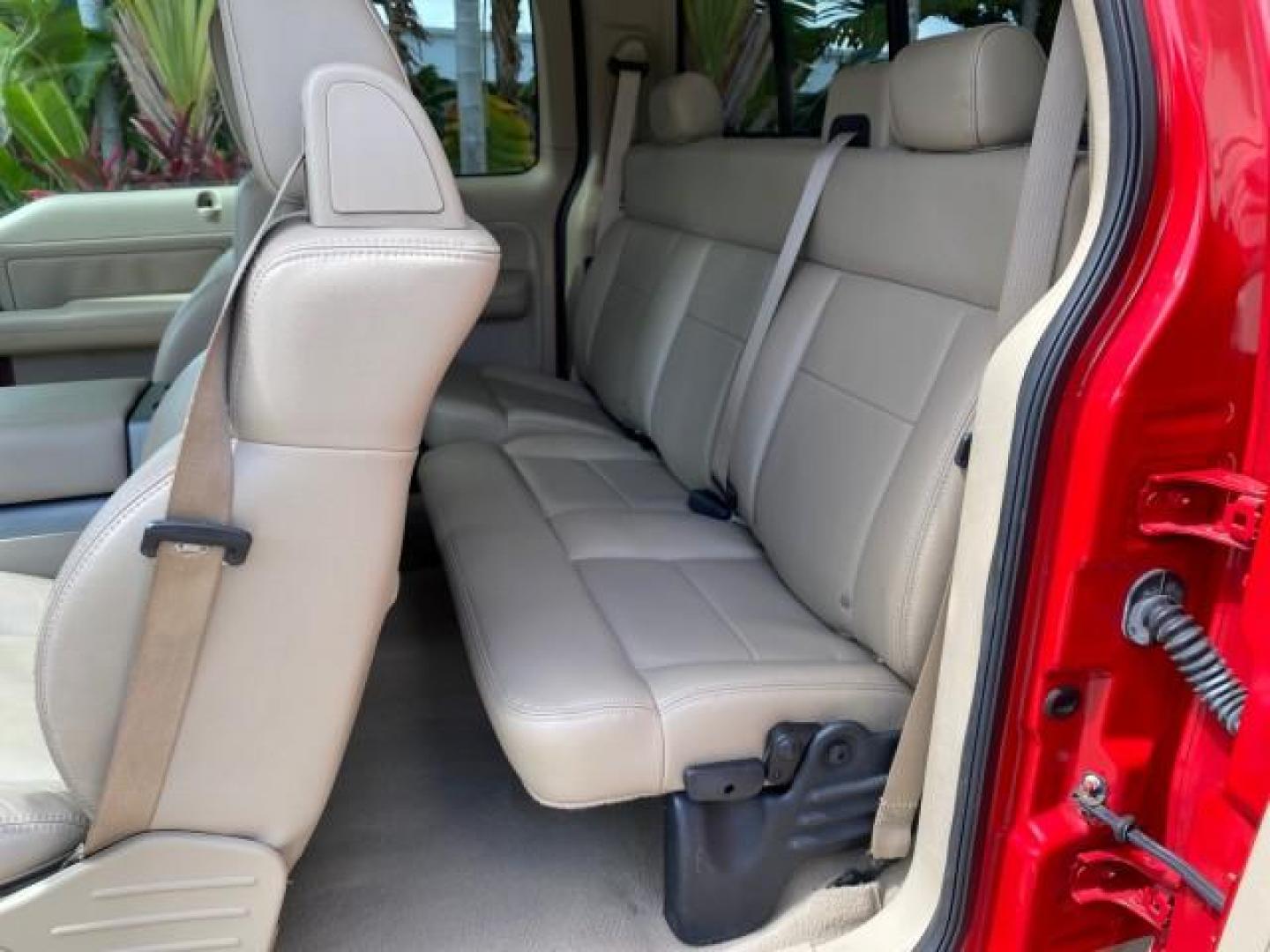2007 Bright Red /Tan Ford F-150 Lariat 4WD LEATHER LOW MILES 80,286 (1FTPX14V97N) with an 5.4L 24-Valve EFI FFV V8 Engine engine, Automatic transmission, located at 4701 North Dixie Hwy, Pompano Beach, FL, 33064, (954) 422-2889, 26.240938, -80.123474 - OUR WEBPAGE FLORIDACARS1.COM HAS OVER 100 PHOTOS AND FREE CARFAX LINK 2007 Ford F-150 Lariat 4 Door Extended Cab Pickup 5.4L V8 F SOHC Flex Fuel 18 MPG Rear Wheel Drive w/ 4X4 Features 20 Inch Plus Wheels 4WD/AWD ABS Brakes Air Conditioning Alloy Wheels AM/FM Stereo Automatic Transmission Auxiliary- Photo#77