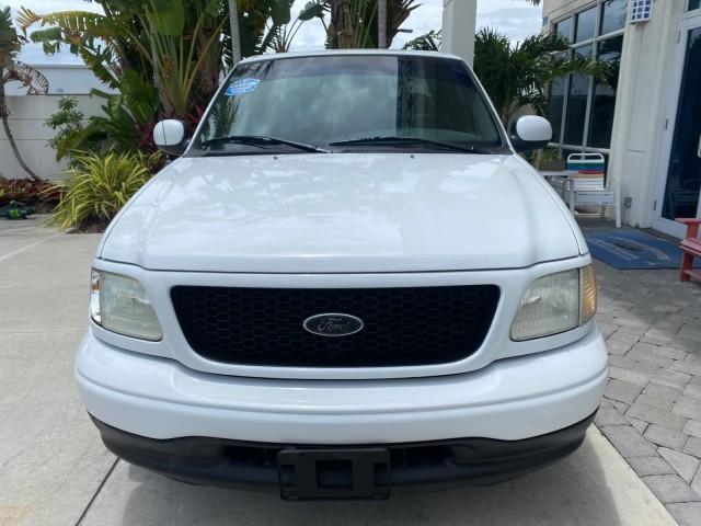 2003 Oxford White /Medium Graphite Ford F-150 XLT SPORT LOW MILES 70,700 1 OWNER (2FTRX17L63C) with an 5.4L 8-Cyl Engine engine, Automatic transmission, located at 4701 North Dixie Hwy, Pompano Beach, FL, 33064, (954) 422-2889, 26.240938, -80.123474 - OUR WEBPAGE FLORIDACARS1.COM HAS OVER 100 PHOTOS AND FREE CARFAX LINK 2003 Ford F-150 XLT 4 Door Extended Cab Pickup 5.4L V8 F SOHC 16V Gasoline 20 MPG Rear Wheel Drive Features ABS Brakes Air Conditioning Alloy Wheels AM/FM Stereo Automatic Transmission Auxiliary Audio Input Bluetooth Technology CD - Photo#2