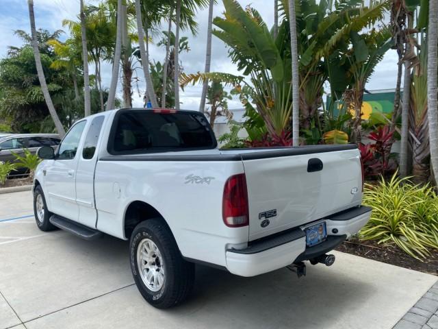 2003 Oxford White /Medium Graphite Ford F-150 XLT SPORT LOW MILES 70,700 1 OWNER (2FTRX17L63C) with an 5.4L 8-Cyl Engine engine, Automatic transmission, located at 4701 North Dixie Hwy, Pompano Beach, FL, 33064, (954) 422-2889, 26.240938, -80.123474 - OUR WEBPAGE FLORIDACARS1.COM HAS OVER 100 PHOTOS AND FREE CARFAX LINK 2003 Ford F-150 XLT 4 Door Extended Cab Pickup 5.4L V8 F SOHC 16V Gasoline 20 MPG Rear Wheel Drive Features ABS Brakes Air Conditioning Alloy Wheels AM/FM Stereo Automatic Transmission Auxiliary Audio Input Bluetooth Technology CD - Photo#5