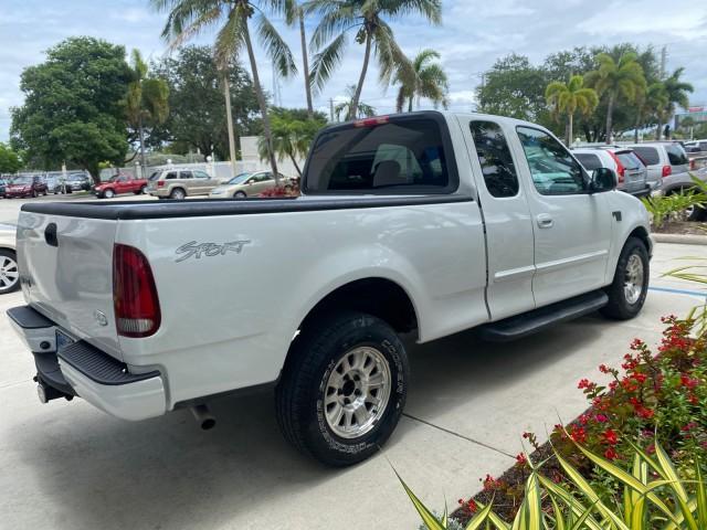 2003 Oxford White /Medium Graphite Ford F-150 XLT SPORT LOW MILES 70,700 1 OWNER (2FTRX17L63C) with an 5.4L 8-Cyl Engine engine, Automatic transmission, located at 4701 North Dixie Hwy, Pompano Beach, FL, 33064, (954) 422-2889, 26.240938, -80.123474 - OUR WEBPAGE FLORIDACARS1.COM HAS OVER 100 PHOTOS AND FREE CARFAX LINK 2003 Ford F-150 XLT 4 Door Extended Cab Pickup 5.4L V8 F SOHC 16V Gasoline 20 MPG Rear Wheel Drive Features ABS Brakes Air Conditioning Alloy Wheels AM/FM Stereo Automatic Transmission Auxiliary Audio Input Bluetooth Technology CD - Photo#7