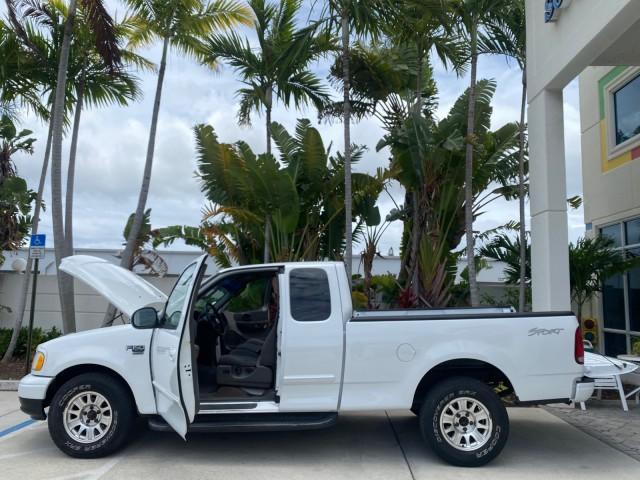 2003 Oxford White /Medium Graphite Ford F-150 XLT SPORT LOW MILES 70,700 1 OWNER (2FTRX17L63C) with an 5.4L 8-Cyl Engine engine, Automatic transmission, located at 4701 North Dixie Hwy, Pompano Beach, FL, 33064, (954) 422-2889, 26.240938, -80.123474 - OUR WEBPAGE FLORIDACARS1.COM HAS OVER 100 PHOTOS AND FREE CARFAX LINK 2003 Ford F-150 XLT 4 Door Extended Cab Pickup 5.4L V8 F SOHC 16V Gasoline 20 MPG Rear Wheel Drive Features ABS Brakes Air Conditioning Alloy Wheels AM/FM Stereo Automatic Transmission Auxiliary Audio Input Bluetooth Technology CD - Photo#8