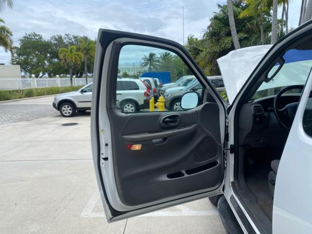 2003 Oxford White /Medium Graphite Ford F-150 XLT SPORT LOW MILES 70,700 1 OWNER (2FTRX17L63C) with an 5.4L 8-Cyl Engine engine, Automatic transmission, located at 4701 North Dixie Hwy, Pompano Beach, FL, 33064, (954) 422-2889, 26.240938, -80.123474 - OUR WEBPAGE FLORIDACARS1.COM HAS OVER 100 PHOTOS AND FREE CARFAX LINK 2003 Ford F-150 XLT 4 Door Extended Cab Pickup 5.4L V8 F SOHC 16V Gasoline 20 MPG Rear Wheel Drive Features ABS Brakes Air Conditioning Alloy Wheels AM/FM Stereo Automatic Transmission Auxiliary Audio Input Bluetooth Technology CD - Photo#9