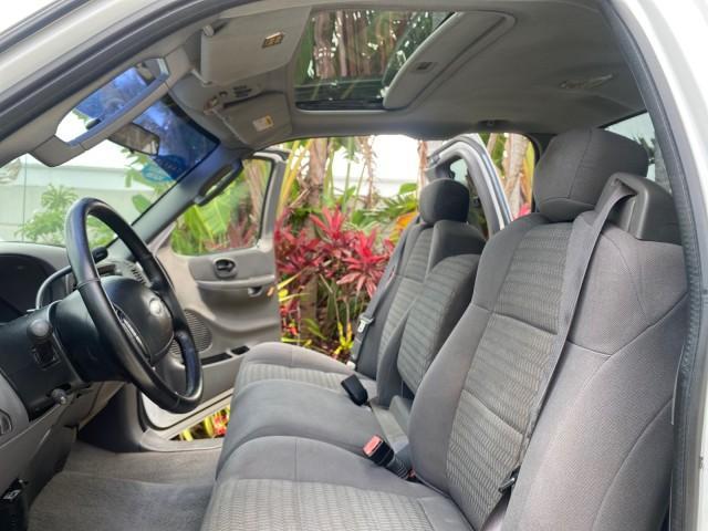 2003 Oxford White /Medium Graphite Ford F-150 XLT SPORT LOW MILES 70,700 1 OWNER (2FTRX17L63C) with an 5.4L 8-Cyl Engine engine, Automatic transmission, located at 4701 North Dixie Hwy, Pompano Beach, FL, 33064, (954) 422-2889, 26.240938, -80.123474 - OUR WEBPAGE FLORIDACARS1.COM HAS OVER 100 PHOTOS AND FREE CARFAX LINK 2003 Ford F-150 XLT 4 Door Extended Cab Pickup 5.4L V8 F SOHC 16V Gasoline 20 MPG Rear Wheel Drive Features ABS Brakes Air Conditioning Alloy Wheels AM/FM Stereo Automatic Transmission Auxiliary Audio Input Bluetooth Technology CD - Photo#10
