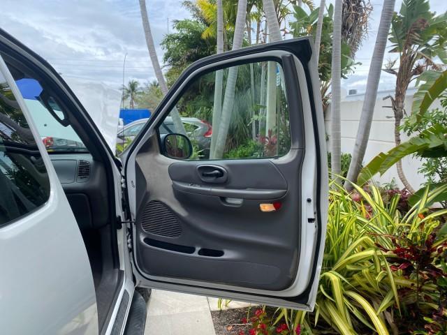 2003 Oxford White /Medium Graphite Ford F-150 XLT SPORT LOW MILES 70,700 1 OWNER (2FTRX17L63C) with an 5.4L 8-Cyl Engine engine, Automatic transmission, located at 4701 North Dixie Hwy, Pompano Beach, FL, 33064, (954) 422-2889, 26.240938, -80.123474 - OUR WEBPAGE FLORIDACARS1.COM HAS OVER 100 PHOTOS AND FREE CARFAX LINK 2003 Ford F-150 XLT 4 Door Extended Cab Pickup 5.4L V8 F SOHC 16V Gasoline 20 MPG Rear Wheel Drive Features ABS Brakes Air Conditioning Alloy Wheels AM/FM Stereo Automatic Transmission Auxiliary Audio Input Bluetooth Technology CD - Photo#11