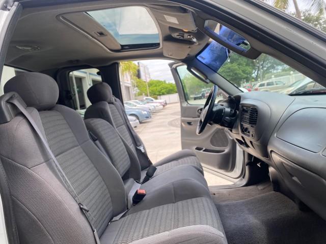 2003 Oxford White /Medium Graphite Ford F-150 XLT SPORT LOW MILES 70,700 1 OWNER (2FTRX17L63C) with an 5.4L 8-Cyl Engine engine, Automatic transmission, located at 4701 North Dixie Hwy, Pompano Beach, FL, 33064, (954) 422-2889, 26.240938, -80.123474 - OUR WEBPAGE FLORIDACARS1.COM HAS OVER 100 PHOTOS AND FREE CARFAX LINK 2003 Ford F-150 XLT 4 Door Extended Cab Pickup 5.4L V8 F SOHC 16V Gasoline 20 MPG Rear Wheel Drive Features ABS Brakes Air Conditioning Alloy Wheels AM/FM Stereo Automatic Transmission Auxiliary Audio Input Bluetooth Technology CD - Photo#12