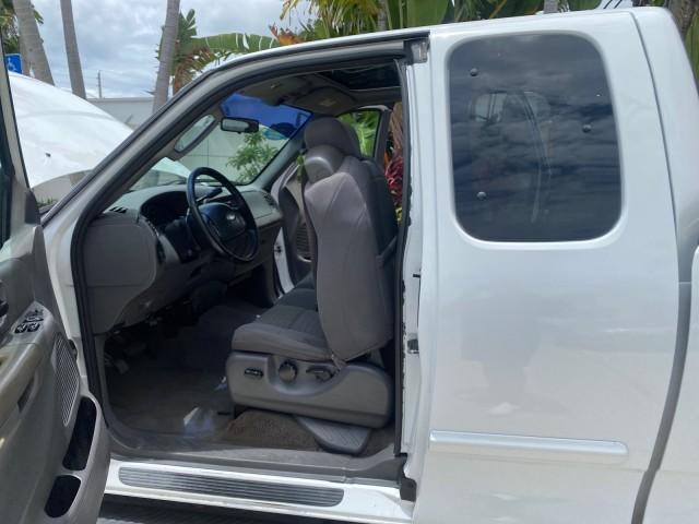 2003 Oxford White /Medium Graphite Ford F-150 XLT SPORT LOW MILES 70,700 1 OWNER (2FTRX17L63C) with an 5.4L 8-Cyl Engine engine, Automatic transmission, located at 4701 North Dixie Hwy, Pompano Beach, FL, 33064, (954) 422-2889, 26.240938, -80.123474 - OUR WEBPAGE FLORIDACARS1.COM HAS OVER 100 PHOTOS AND FREE CARFAX LINK 2003 Ford F-150 XLT 4 Door Extended Cab Pickup 5.4L V8 F SOHC 16V Gasoline 20 MPG Rear Wheel Drive Features ABS Brakes Air Conditioning Alloy Wheels AM/FM Stereo Automatic Transmission Auxiliary Audio Input Bluetooth Technology CD - Photo#13