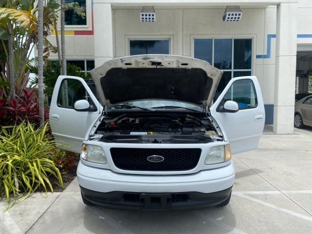 2003 Oxford White /Medium Graphite Ford F-150 XLT SPORT LOW MILES 70,700 1 OWNER (2FTRX17L63C) with an 5.4L 8-Cyl Engine engine, Automatic transmission, located at 4701 North Dixie Hwy, Pompano Beach, FL, 33064, (954) 422-2889, 26.240938, -80.123474 - OUR WEBPAGE FLORIDACARS1.COM HAS OVER 100 PHOTOS AND FREE CARFAX LINK 2003 Ford F-150 XLT 4 Door Extended Cab Pickup 5.4L V8 F SOHC 16V Gasoline 20 MPG Rear Wheel Drive Features ABS Brakes Air Conditioning Alloy Wheels AM/FM Stereo Automatic Transmission Auxiliary Audio Input Bluetooth Technology CD - Photo#16
