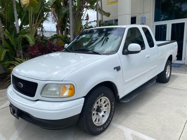 2003 Oxford White /Medium Graphite Ford F-150 XLT SPORT LOW MILES 70,700 1 OWNER (2FTRX17L63C) with an 5.4L 8-Cyl Engine engine, Automatic transmission, located at 4701 North Dixie Hwy, Pompano Beach, FL, 33064, (954) 422-2889, 26.240938, -80.123474 - OUR WEBPAGE FLORIDACARS1.COM HAS OVER 100 PHOTOS AND FREE CARFAX LINK 2003 Ford F-150 XLT 4 Door Extended Cab Pickup 5.4L V8 F SOHC 16V Gasoline 20 MPG Rear Wheel Drive Features ABS Brakes Air Conditioning Alloy Wheels AM/FM Stereo Automatic Transmission Auxiliary Audio Input Bluetooth Technology CD - Photo#29