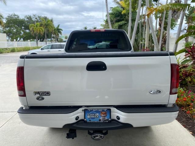 2003 Oxford White /Medium Graphite Ford F-150 XLT SPORT LOW MILES 70,700 1 OWNER (2FTRX17L63C) with an 5.4L 8-Cyl Engine engine, Automatic transmission, located at 4701 North Dixie Hwy, Pompano Beach, FL, 33064, (954) 422-2889, 26.240938, -80.123474 - OUR WEBPAGE FLORIDACARS1.COM HAS OVER 100 PHOTOS AND FREE CARFAX LINK 2003 Ford F-150 XLT 4 Door Extended Cab Pickup 5.4L V8 F SOHC 16V Gasoline 20 MPG Rear Wheel Drive Features ABS Brakes Air Conditioning Alloy Wheels AM/FM Stereo Automatic Transmission Auxiliary Audio Input Bluetooth Technology CD - Photo#35