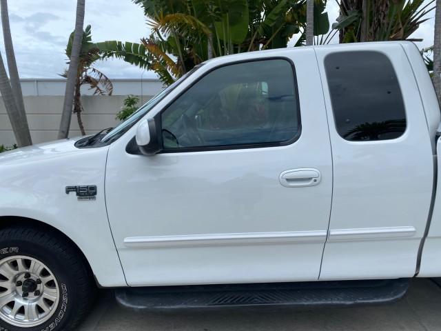 2003 Oxford White /Medium Graphite Ford F-150 XLT SPORT LOW MILES 70,700 1 OWNER (2FTRX17L63C) with an 5.4L 8-Cyl Engine engine, Automatic transmission, located at 4701 North Dixie Hwy, Pompano Beach, FL, 33064, (954) 422-2889, 26.240938, -80.123474 - OUR WEBPAGE FLORIDACARS1.COM HAS OVER 100 PHOTOS AND FREE CARFAX LINK 2003 Ford F-150 XLT 4 Door Extended Cab Pickup 5.4L V8 F SOHC 16V Gasoline 20 MPG Rear Wheel Drive Features ABS Brakes Air Conditioning Alloy Wheels AM/FM Stereo Automatic Transmission Auxiliary Audio Input Bluetooth Technology CD - Photo#37