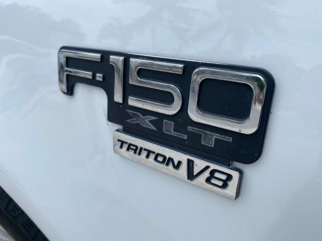 2003 Oxford White /Medium Graphite Ford F-150 XLT SPORT LOW MILES 70,700 1 OWNER (2FTRX17L63C) with an 5.4L 8-Cyl Engine engine, Automatic transmission, located at 4701 North Dixie Hwy, Pompano Beach, FL, 33064, (954) 422-2889, 26.240938, -80.123474 - OUR WEBPAGE FLORIDACARS1.COM HAS OVER 100 PHOTOS AND FREE CARFAX LINK 2003 Ford F-150 XLT 4 Door Extended Cab Pickup 5.4L V8 F SOHC 16V Gasoline 20 MPG Rear Wheel Drive Features ABS Brakes Air Conditioning Alloy Wheels AM/FM Stereo Automatic Transmission Auxiliary Audio Input Bluetooth Technology CD - Photo#41