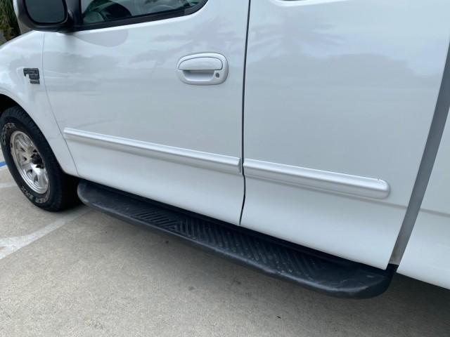 2003 Oxford White /Medium Graphite Ford F-150 XLT SPORT LOW MILES 70,700 1 OWNER (2FTRX17L63C) with an 5.4L 8-Cyl Engine engine, Automatic transmission, located at 4701 North Dixie Hwy, Pompano Beach, FL, 33064, (954) 422-2889, 26.240938, -80.123474 - OUR WEBPAGE FLORIDACARS1.COM HAS OVER 100 PHOTOS AND FREE CARFAX LINK 2003 Ford F-150 XLT 4 Door Extended Cab Pickup 5.4L V8 F SOHC 16V Gasoline 20 MPG Rear Wheel Drive Features ABS Brakes Air Conditioning Alloy Wheels AM/FM Stereo Automatic Transmission Auxiliary Audio Input Bluetooth Technology CD - Photo#42