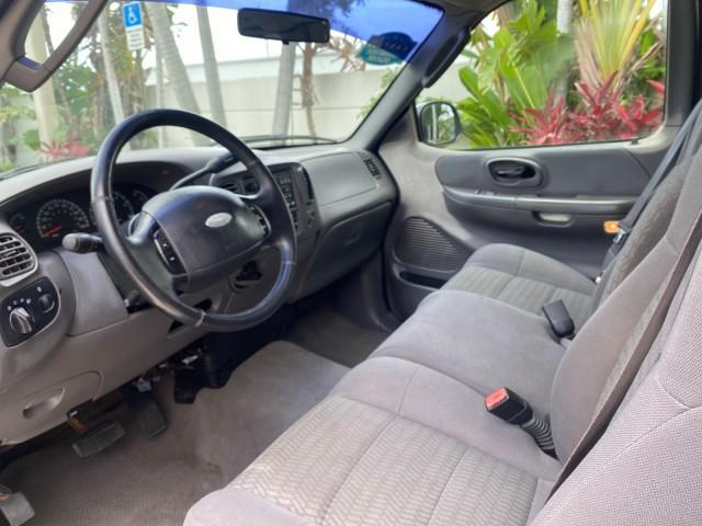 2003 Oxford White /Medium Graphite Ford F-150 XLT SPORT LOW MILES 70,700 1 OWNER (2FTRX17L63C) with an 5.4L 8-Cyl Engine engine, Automatic transmission, located at 4701 North Dixie Hwy, Pompano Beach, FL, 33064, (954) 422-2889, 26.240938, -80.123474 - OUR WEBPAGE FLORIDACARS1.COM HAS OVER 100 PHOTOS AND FREE CARFAX LINK 2003 Ford F-150 XLT 4 Door Extended Cab Pickup 5.4L V8 F SOHC 16V Gasoline 20 MPG Rear Wheel Drive Features ABS Brakes Air Conditioning Alloy Wheels AM/FM Stereo Automatic Transmission Auxiliary Audio Input Bluetooth Technology CD - Photo#47