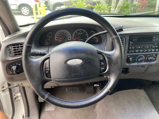 2003 Oxford White /Medium Graphite Ford F-150 XLT SPORT LOW MILES 70,700 1 OWNER (2FTRX17L63C) with an 5.4L 8-Cyl Engine engine, Automatic transmission, located at 4701 North Dixie Hwy, Pompano Beach, FL, 33064, (954) 422-2889, 26.240938, -80.123474 - OUR WEBPAGE FLORIDACARS1.COM HAS OVER 100 PHOTOS AND FREE CARFAX LINK 2003 Ford F-150 XLT 4 Door Extended Cab Pickup 5.4L V8 F SOHC 16V Gasoline 20 MPG Rear Wheel Drive Features ABS Brakes Air Conditioning Alloy Wheels AM/FM Stereo Automatic Transmission Auxiliary Audio Input Bluetooth Technology CD - Photo#49