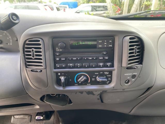 2003 Oxford White /Medium Graphite Ford F-150 XLT SPORT LOW MILES 70,700 1 OWNER (2FTRX17L63C) with an 5.4L 8-Cyl Engine engine, Automatic transmission, located at 4701 North Dixie Hwy, Pompano Beach, FL, 33064, (954) 422-2889, 26.240938, -80.123474 - OUR WEBPAGE FLORIDACARS1.COM HAS OVER 100 PHOTOS AND FREE CARFAX LINK 2003 Ford F-150 XLT 4 Door Extended Cab Pickup 5.4L V8 F SOHC 16V Gasoline 20 MPG Rear Wheel Drive Features ABS Brakes Air Conditioning Alloy Wheels AM/FM Stereo Automatic Transmission Auxiliary Audio Input Bluetooth Technology CD - Photo#57