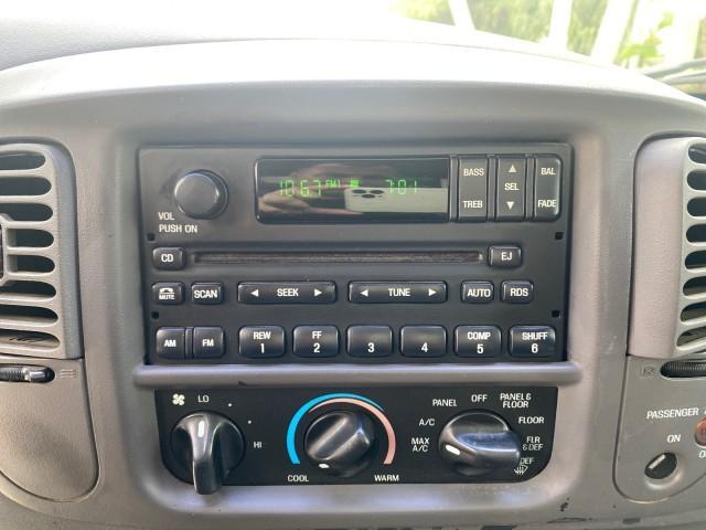 2003 Oxford White /Medium Graphite Ford F-150 XLT SPORT LOW MILES 70,700 1 OWNER (2FTRX17L63C) with an 5.4L 8-Cyl Engine engine, Automatic transmission, located at 4701 North Dixie Hwy, Pompano Beach, FL, 33064, (954) 422-2889, 26.240938, -80.123474 - OUR WEBPAGE FLORIDACARS1.COM HAS OVER 100 PHOTOS AND FREE CARFAX LINK 2003 Ford F-150 XLT 4 Door Extended Cab Pickup 5.4L V8 F SOHC 16V Gasoline 20 MPG Rear Wheel Drive Features ABS Brakes Air Conditioning Alloy Wheels AM/FM Stereo Automatic Transmission Auxiliary Audio Input Bluetooth Technology CD - Photo#58
