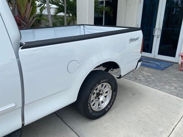 2003 Oxford White /Medium Graphite Ford F-150 XLT SPORT LOW MILES 70,700 1 OWNER (2FTRX17L63C) with an 5.4L 8-Cyl Engine engine, Automatic transmission, located at 4701 North Dixie Hwy, Pompano Beach, FL, 33064, (954) 422-2889, 26.240938, -80.123474 - OUR WEBPAGE FLORIDACARS1.COM HAS OVER 100 PHOTOS AND FREE CARFAX LINK 2003 Ford F-150 XLT 4 Door Extended Cab Pickup 5.4L V8 F SOHC 16V Gasoline 20 MPG Rear Wheel Drive Features ABS Brakes Air Conditioning Alloy Wheels AM/FM Stereo Automatic Transmission Auxiliary Audio Input Bluetooth Technology CD - Photo#76