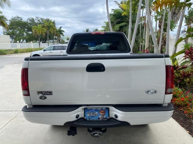 2003 Oxford White /Medium Graphite Ford F-150 XLT SPORT LOW MILES 70,700 1 OWNER (2FTRX17L63C) with an 5.4L 8-Cyl Engine engine, Automatic transmission, located at 4701 North Dixie Hwy, Pompano Beach, FL, 33064, (954) 422-2889, 26.240938, -80.123474 - OUR WEBPAGE FLORIDACARS1.COM HAS OVER 100 PHOTOS AND FREE CARFAX LINK 2003 Ford F-150 XLT 4 Door Extended Cab Pickup 5.4L V8 F SOHC 16V Gasoline 20 MPG Rear Wheel Drive Features ABS Brakes Air Conditioning Alloy Wheels AM/FM Stereo Automatic Transmission Auxiliary Audio Input Bluetooth Technology CD - Photo#88