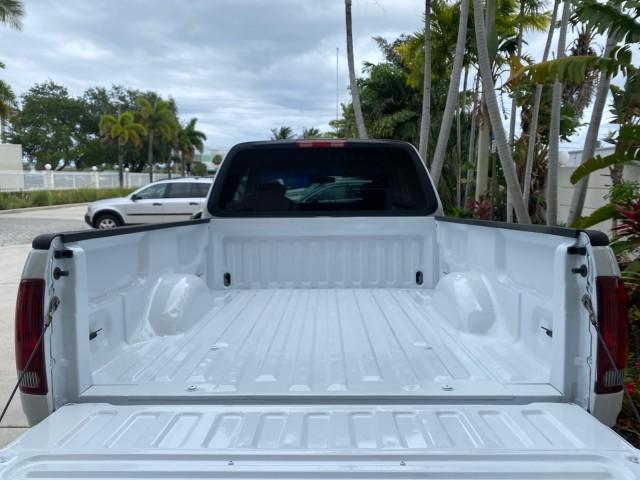 2003 Oxford White /Medium Graphite Ford F-150 XLT SPORT LOW MILES 70,700 1 OWNER (2FTRX17L63C) with an 5.4L 8-Cyl Engine engine, Automatic transmission, located at 4701 North Dixie Hwy, Pompano Beach, FL, 33064, (954) 422-2889, 26.240938, -80.123474 - OUR WEBPAGE FLORIDACARS1.COM HAS OVER 100 PHOTOS AND FREE CARFAX LINK 2003 Ford F-150 XLT 4 Door Extended Cab Pickup 5.4L V8 F SOHC 16V Gasoline 20 MPG Rear Wheel Drive Features ABS Brakes Air Conditioning Alloy Wheels AM/FM Stereo Automatic Transmission Auxiliary Audio Input Bluetooth Technology CD - Photo#97