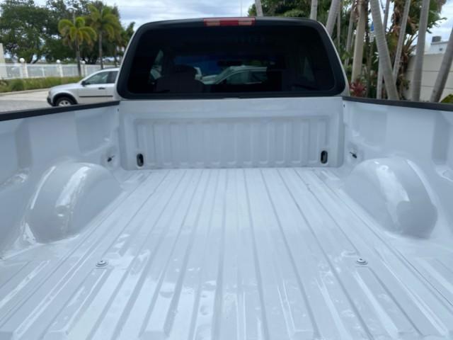 2003 Oxford White /Medium Graphite Ford F-150 XLT SPORT LOW MILES 70,700 1 OWNER (2FTRX17L63C) with an 5.4L 8-Cyl Engine engine, Automatic transmission, located at 4701 North Dixie Hwy, Pompano Beach, FL, 33064, (954) 422-2889, 26.240938, -80.123474 - OUR WEBPAGE FLORIDACARS1.COM HAS OVER 100 PHOTOS AND FREE CARFAX LINK 2003 Ford F-150 XLT 4 Door Extended Cab Pickup 5.4L V8 F SOHC 16V Gasoline 20 MPG Rear Wheel Drive Features ABS Brakes Air Conditioning Alloy Wheels AM/FM Stereo Automatic Transmission Auxiliary Audio Input Bluetooth Technology CD - Photo#99