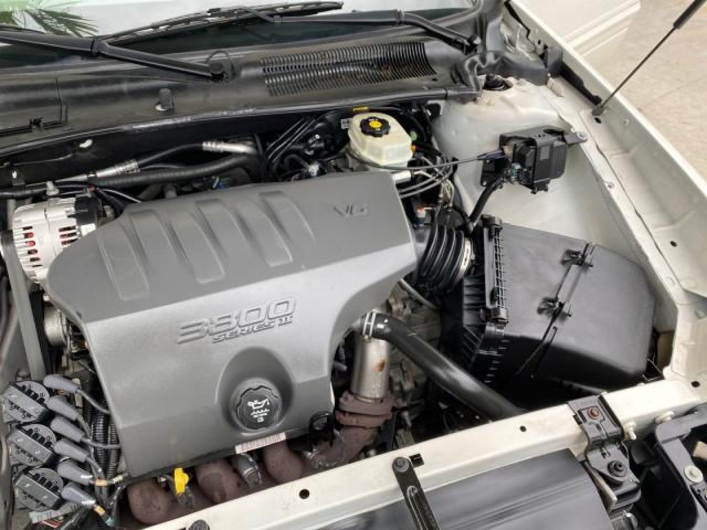 2003 White /Taupe Buick LeSabre LEATHER LOADED LOW MILES 25,425 (1G4HP52K034) with an 3.8L 3800 V6 SFI Engine engine, Automatic transmission, located at 4701 North Dixie Hwy, Pompano Beach, FL, 33064, (954) 422-2889, 26.240938, -80.123474 - OUR WEBPAGE FLORIDACARS1.COM HAS OVER 100 PHOTOS AND FREE CARFAX LINK 2003 Buick Lesabre Custom Sedan 4 DR 3.8L V6 F 12V Gasoline 29 MPG Front Wheel Drive Features ABS Brakes Air Conditioning AM/FM Stereo Automatic Transmission Cassette Player CD Audio Cruise Control Leather Seats Power Locks Power- Photo#24