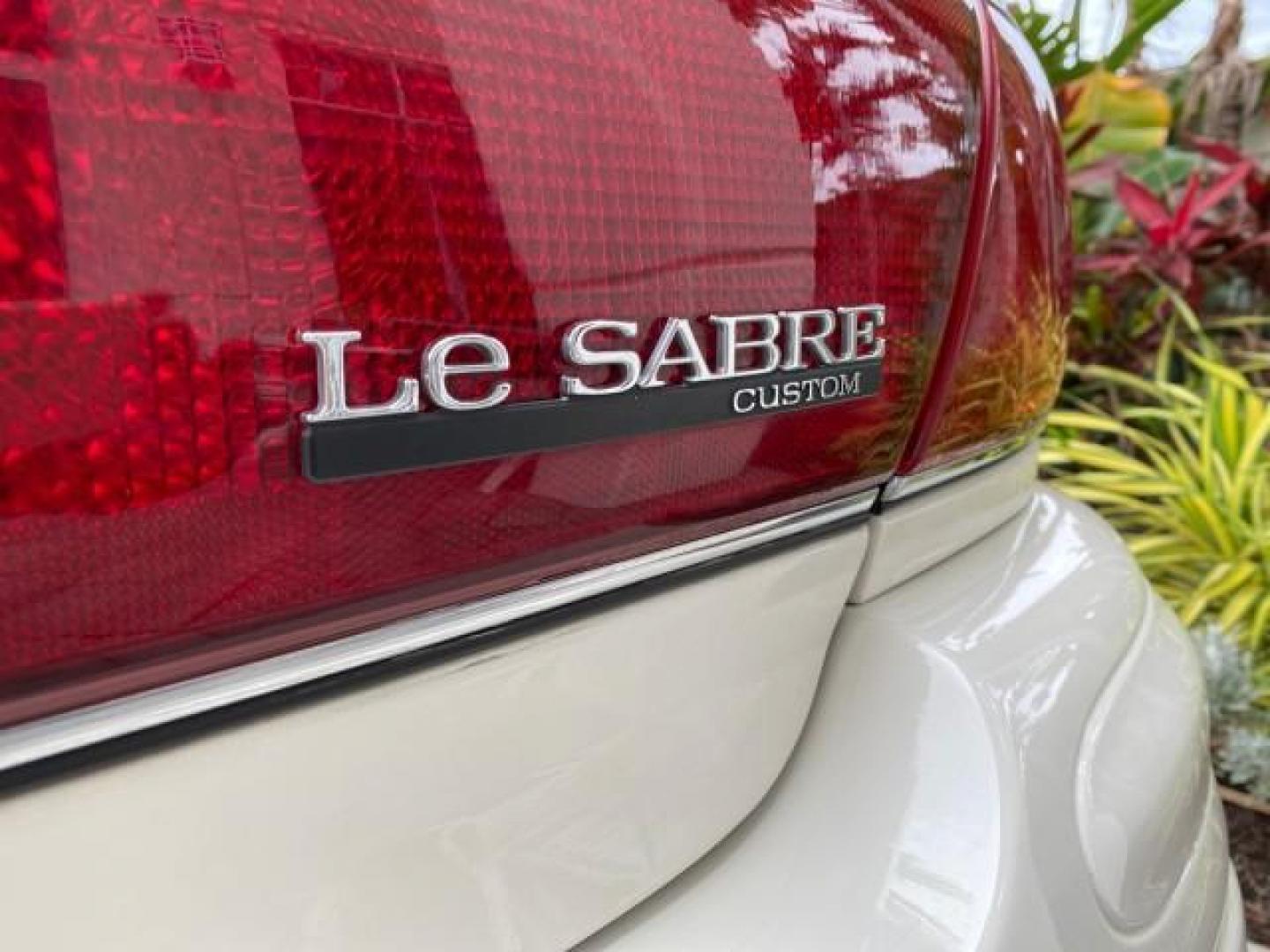2003 White /Taupe Buick LeSabre LEATHER LOADED LOW MILES 25,425 (1G4HP52K034) with an 3.8L 3800 V6 SFI Engine engine, Automatic transmission, located at 4701 North Dixie Hwy, Pompano Beach, FL, 33064, (954) 422-2889, 26.240938, -80.123474 - OUR WEBPAGE FLORIDACARS1.COM HAS OVER 100 PHOTOS AND FREE CARFAX LINK 2003 Buick Lesabre Custom Sedan 4 DR 3.8L V6 F 12V Gasoline 29 MPG Front Wheel Drive Features ABS Brakes Air Conditioning AM/FM Stereo Automatic Transmission Cassette Player CD Audio Cruise Control Leather Seats Power Locks Power- Photo#88