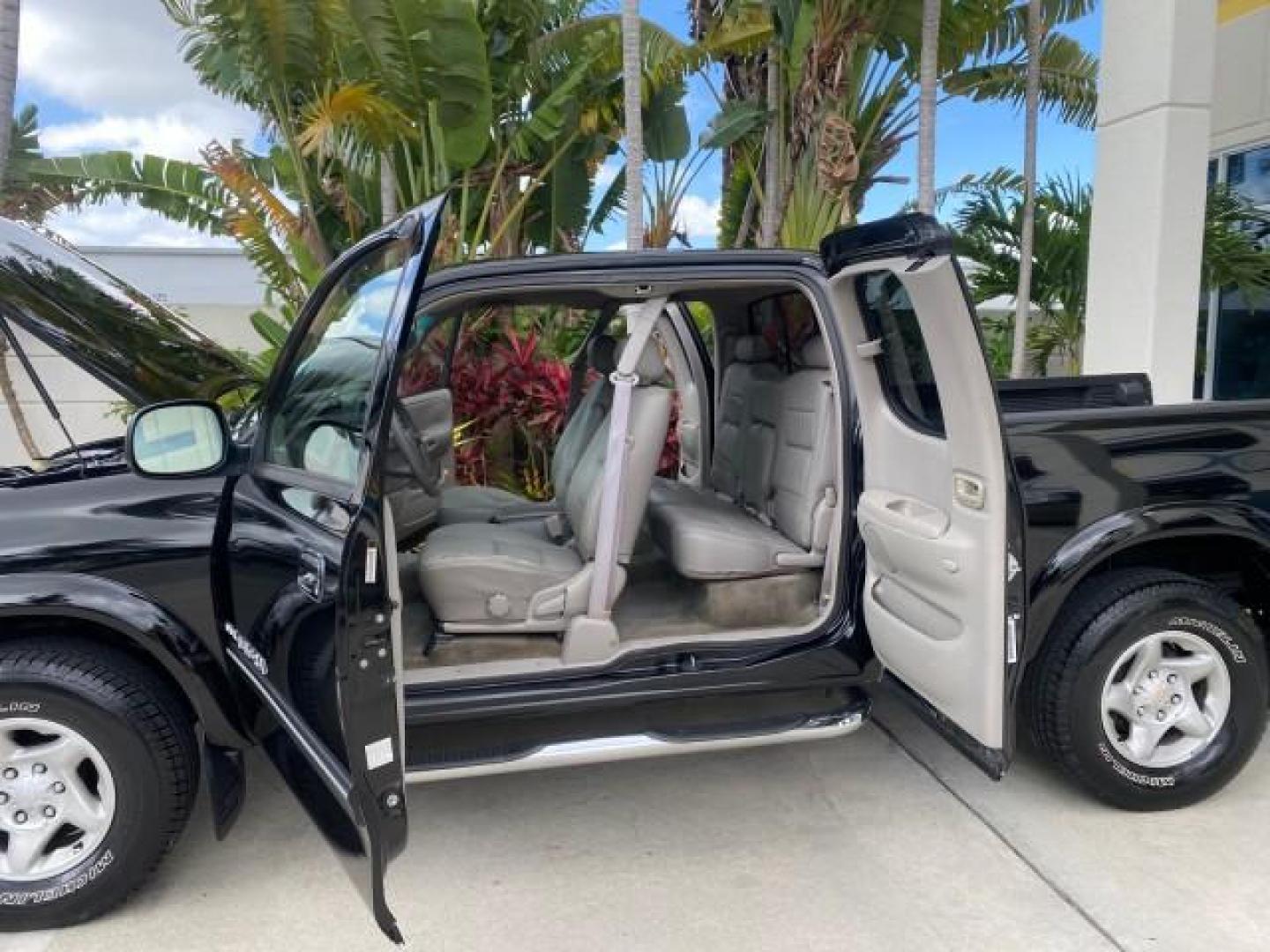 2002 Black /Oak Toyota Tundra ACCESS SR5 LEATHER LOW MILES 90,481 (5TBRN34102S) with an 3.4L DOHC EFI 24-Valve V6 Engine engine, Automatic transmission, located at 4701 North Dixie Hwy, Pompano Beach, FL, 33064, (954) 422-2889, 26.240938, -80.123474 - OUR WEBPAGE FLORIDACARS1.COM HAS OVER 100 PHOTOS AND FREE CARFAX LINK 2002 Toyota Tundra SR5 4 Door Extended Cab Pickup 3.4L V6 F DOHC 24V Gasoline 20 MPG Rear Wheel Drive Features ABS Brakes Air Conditioning Alloy Wheels AM/FM Stereo Automatic Transmission Bed Liner CD Audio Cruise Control Leather- Photo#13