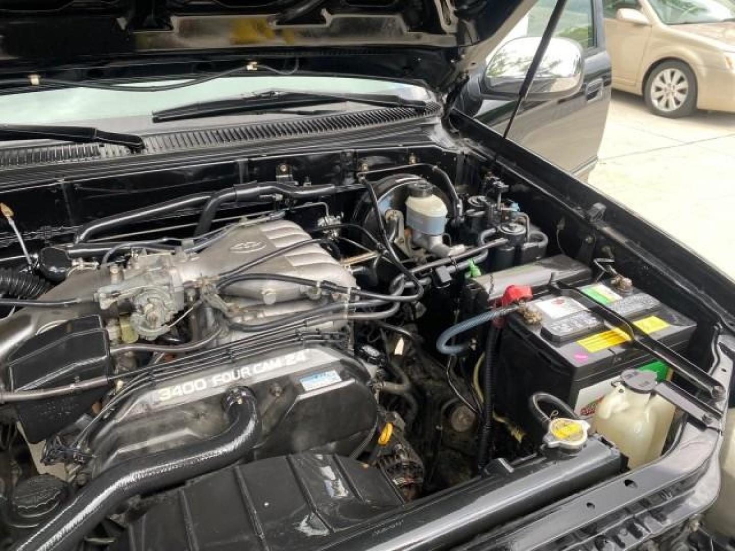 2002 Black /Oak Toyota Tundra ACCESS SR5 LEATHER LOW MILES 90,481 (5TBRN34102S) with an 3.4L DOHC EFI 24-Valve V6 Engine engine, Automatic transmission, located at 4701 North Dixie Hwy, Pompano Beach, FL, 33064, (954) 422-2889, 26.240938, -80.123474 - OUR WEBPAGE FLORIDACARS1.COM HAS OVER 100 PHOTOS AND FREE CARFAX LINK 2002 Toyota Tundra SR5 4 Door Extended Cab Pickup 3.4L V6 F DOHC 24V Gasoline 20 MPG Rear Wheel Drive Features ABS Brakes Air Conditioning Alloy Wheels AM/FM Stereo Automatic Transmission Bed Liner CD Audio Cruise Control Leather- Photo#25