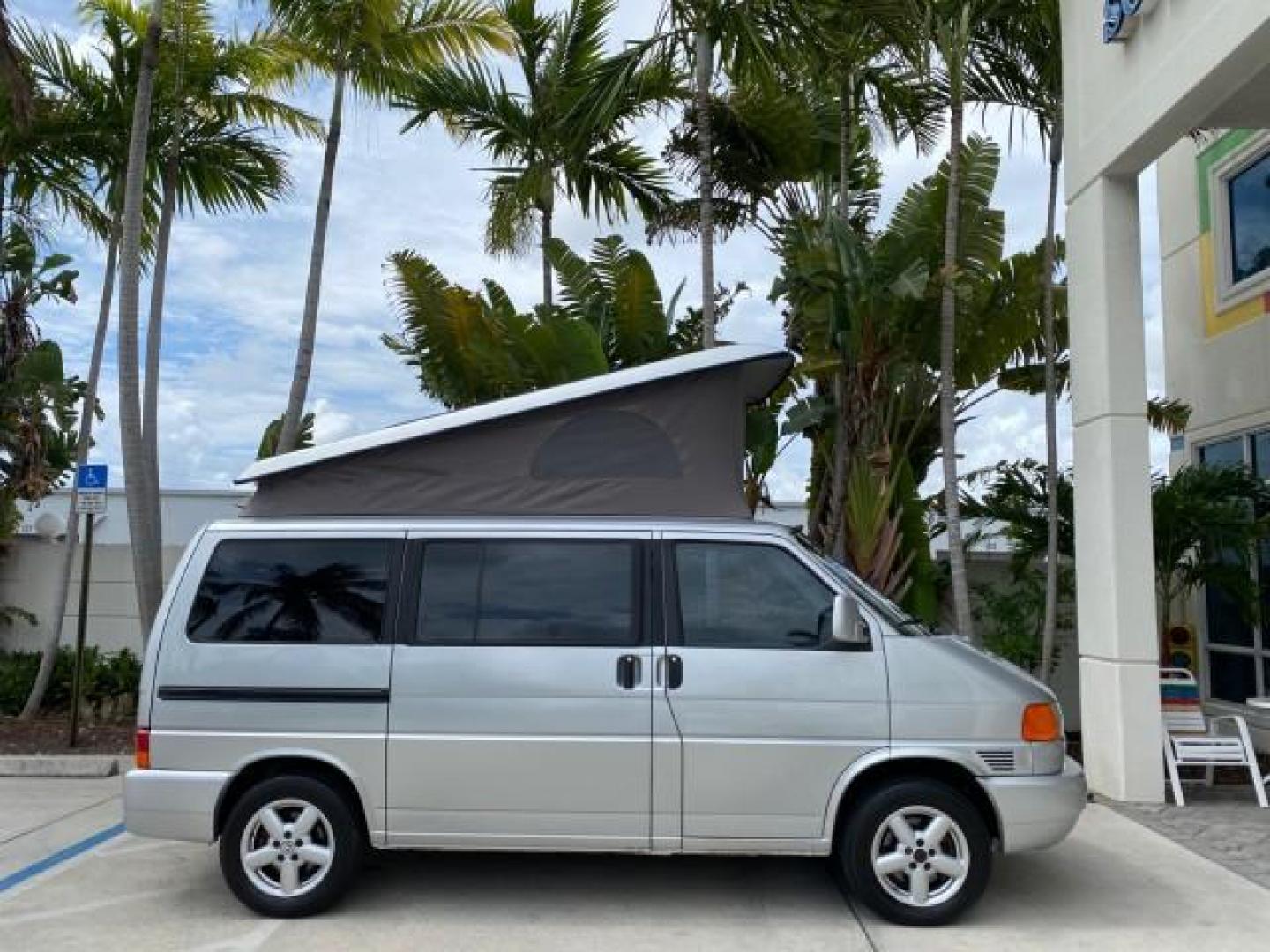 2003 Reflex Silver /Gray Volkswagen EuroVan MV POP UP CAMPER VAN (WV2NB47093H) with an 2.8L DOHC SMPI V6 Engine engine, Automatic transmission, located at 4701 North Dixie Hwy, Pompano Beach, FL, 33064, (954) 422-2889, 26.240938, -80.123474 - OUR WEBPAGE FLORIDACARS1.COM HAS OVER 100 PHOTOS AND FREE CARFAX LINK 2003 Volkswagen Eurovan MV Westfalia Pop Top Camper Van 2.8L I6 F Gasoline 20 MPG Front Wheel Drive Features ABS Brakes Air Conditioning Alloy Wheels AM/FM Stereo Automatic Transmission Cloth Seats Cruise Control Power Locks Power- Photo#4