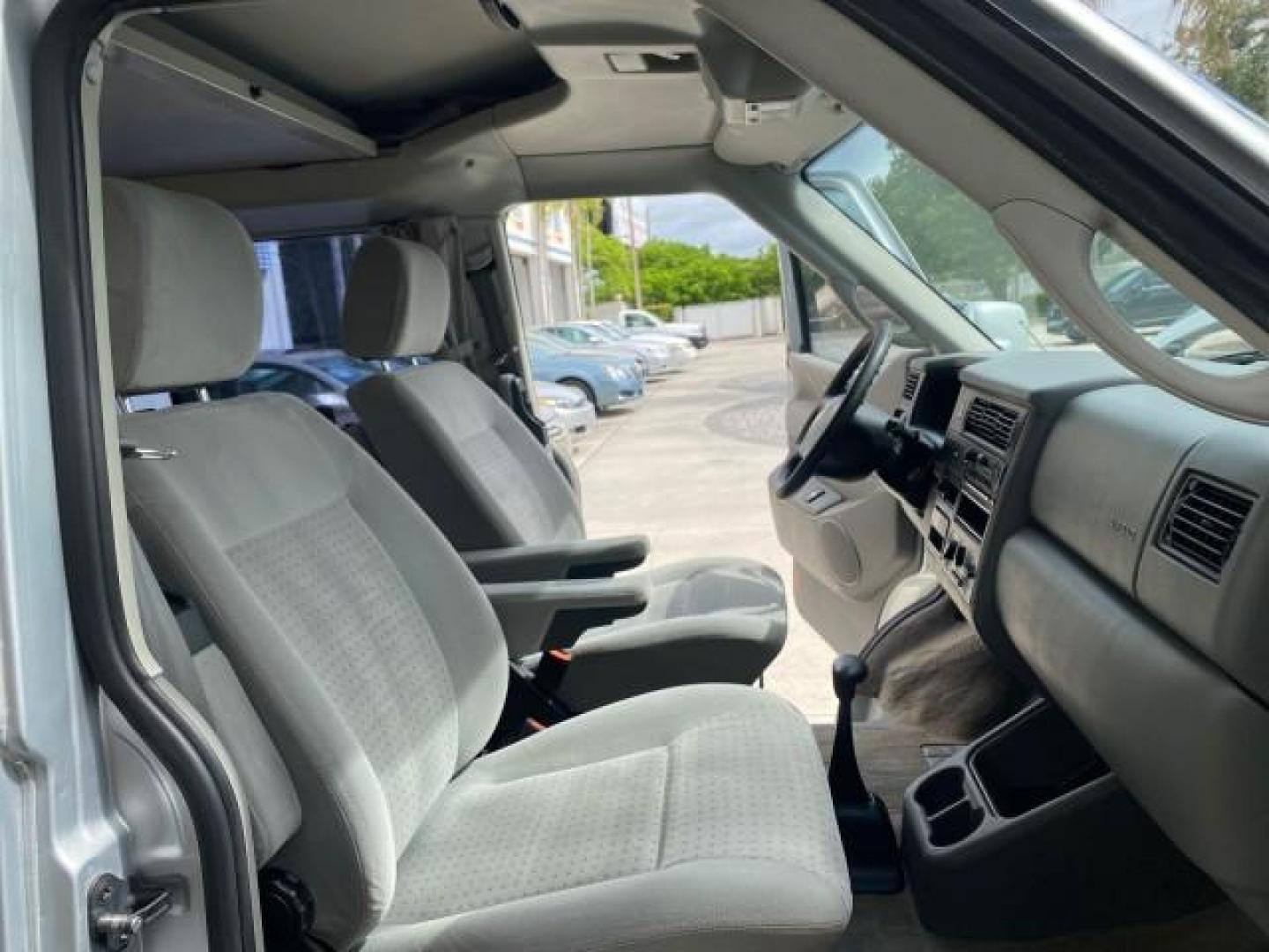 2003 Reflex Silver /Gray Volkswagen EuroVan MV POP UP CAMPER VAN (WV2NB47093H) with an 2.8L DOHC SMPI V6 Engine engine, Automatic transmission, located at 4701 North Dixie Hwy, Pompano Beach, FL, 33064, (954) 422-2889, 26.240938, -80.123474 - OUR WEBPAGE FLORIDACARS1.COM HAS OVER 100 PHOTOS AND FREE CARFAX LINK 2003 Volkswagen Eurovan MV Westfalia Pop Top Camper Van 2.8L I6 F Gasoline 20 MPG Front Wheel Drive Features ABS Brakes Air Conditioning Alloy Wheels AM/FM Stereo Automatic Transmission Cloth Seats Cruise Control Power Locks Power- Photo#12