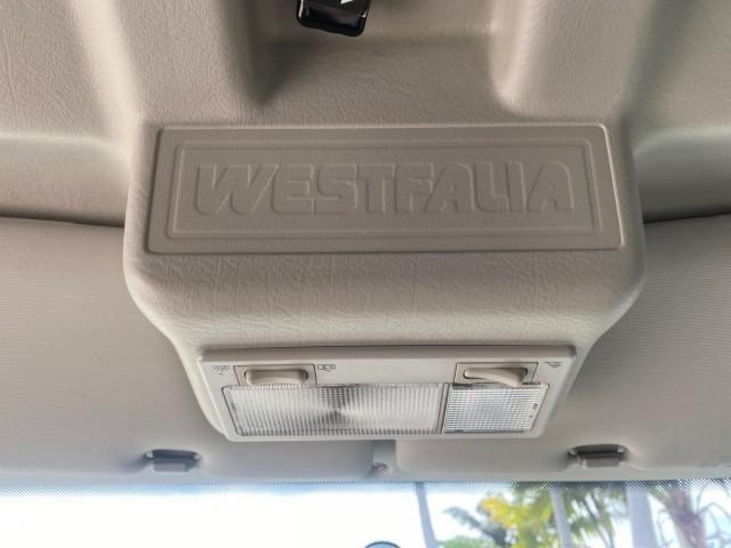 2003 Reflex Silver /Gray Volkswagen EuroVan MV POP UP CAMPER VAN (WV2NB47093H) with an 2.8L DOHC SMPI V6 Engine engine, Automatic transmission, located at 4701 North Dixie Hwy, Pompano Beach, FL, 33064, (954) 422-2889, 26.240938, -80.123474 - OUR WEBPAGE FLORIDACARS1.COM HAS OVER 100 PHOTOS AND FREE CARFAX LINK 2003 Volkswagen Eurovan MV Westfalia Pop Top Camper Van 2.8L I6 F Gasoline 20 MPG Front Wheel Drive Features ABS Brakes Air Conditioning Alloy Wheels AM/FM Stereo Automatic Transmission Cloth Seats Cruise Control Power Locks Power- Photo#63