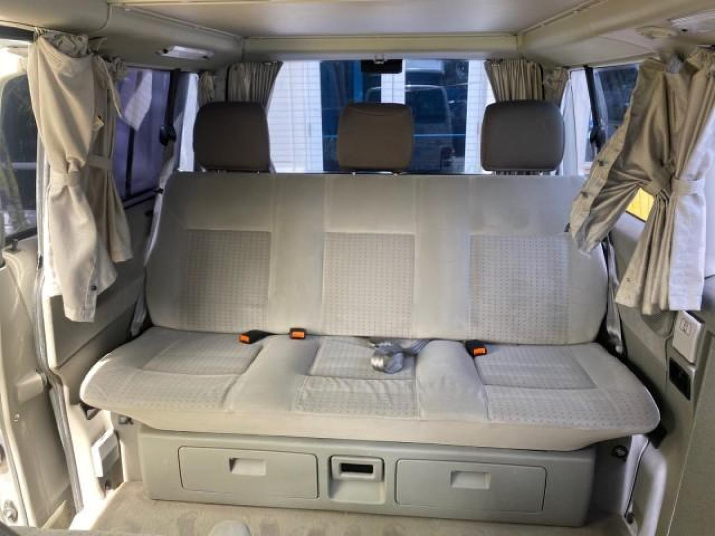 2003 Reflex Silver /Gray Volkswagen EuroVan MV POP UP CAMPER VAN (WV2NB47093H) with an 2.8L DOHC SMPI V6 Engine engine, Automatic transmission, located at 4701 North Dixie Hwy, Pompano Beach, FL, 33064, (954) 422-2889, 26.240938, -80.123474 - OUR WEBPAGE FLORIDACARS1.COM HAS OVER 100 PHOTOS AND FREE CARFAX LINK 2003 Volkswagen Eurovan MV Westfalia Pop Top Camper Van 2.8L I6 F Gasoline 20 MPG Front Wheel Drive Features ABS Brakes Air Conditioning Alloy Wheels AM/FM Stereo Automatic Transmission Cloth Seats Cruise Control Power Locks Power- Photo#79
