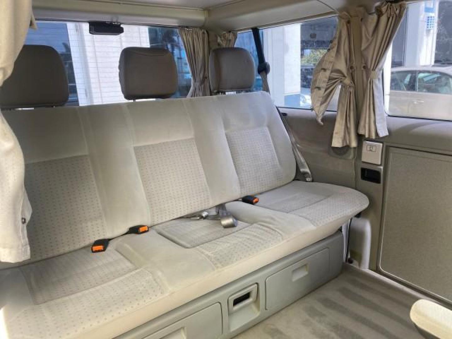 2003 Reflex Silver /Gray Volkswagen EuroVan MV POP UP CAMPER VAN (WV2NB47093H) with an 2.8L DOHC SMPI V6 Engine engine, Automatic transmission, located at 4701 North Dixie Hwy, Pompano Beach, FL, 33064, (954) 422-2889, 26.240938, -80.123474 - OUR WEBPAGE FLORIDACARS1.COM HAS OVER 100 PHOTOS AND FREE CARFAX LINK 2003 Volkswagen Eurovan MV Westfalia Pop Top Camper Van 2.8L I6 F Gasoline 20 MPG Front Wheel Drive Features ABS Brakes Air Conditioning Alloy Wheels AM/FM Stereo Automatic Transmission Cloth Seats Cruise Control Power Locks Power- Photo#80