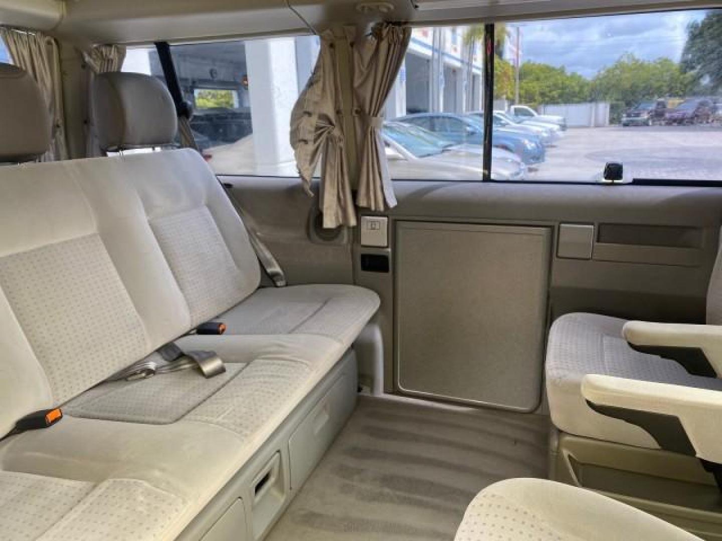 2003 Reflex Silver /Gray Volkswagen EuroVan MV POP UP CAMPER VAN (WV2NB47093H) with an 2.8L DOHC SMPI V6 Engine engine, Automatic transmission, located at 4701 North Dixie Hwy, Pompano Beach, FL, 33064, (954) 422-2889, 26.240938, -80.123474 - OUR WEBPAGE FLORIDACARS1.COM HAS OVER 100 PHOTOS AND FREE CARFAX LINK 2003 Volkswagen Eurovan MV Westfalia Pop Top Camper Van 2.8L I6 F Gasoline 20 MPG Front Wheel Drive Features ABS Brakes Air Conditioning Alloy Wheels AM/FM Stereo Automatic Transmission Cloth Seats Cruise Control Power Locks Power- Photo#81