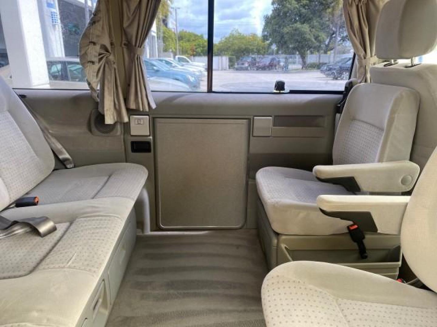 2003 Reflex Silver /Gray Volkswagen EuroVan MV POP UP CAMPER VAN (WV2NB47093H) with an 2.8L DOHC SMPI V6 Engine engine, Automatic transmission, located at 4701 North Dixie Hwy, Pompano Beach, FL, 33064, (954) 422-2889, 26.240938, -80.123474 - OUR WEBPAGE FLORIDACARS1.COM HAS OVER 100 PHOTOS AND FREE CARFAX LINK 2003 Volkswagen Eurovan MV Westfalia Pop Top Camper Van 2.8L I6 F Gasoline 20 MPG Front Wheel Drive Features ABS Brakes Air Conditioning Alloy Wheels AM/FM Stereo Automatic Transmission Cloth Seats Cruise Control Power Locks Power- Photo#82