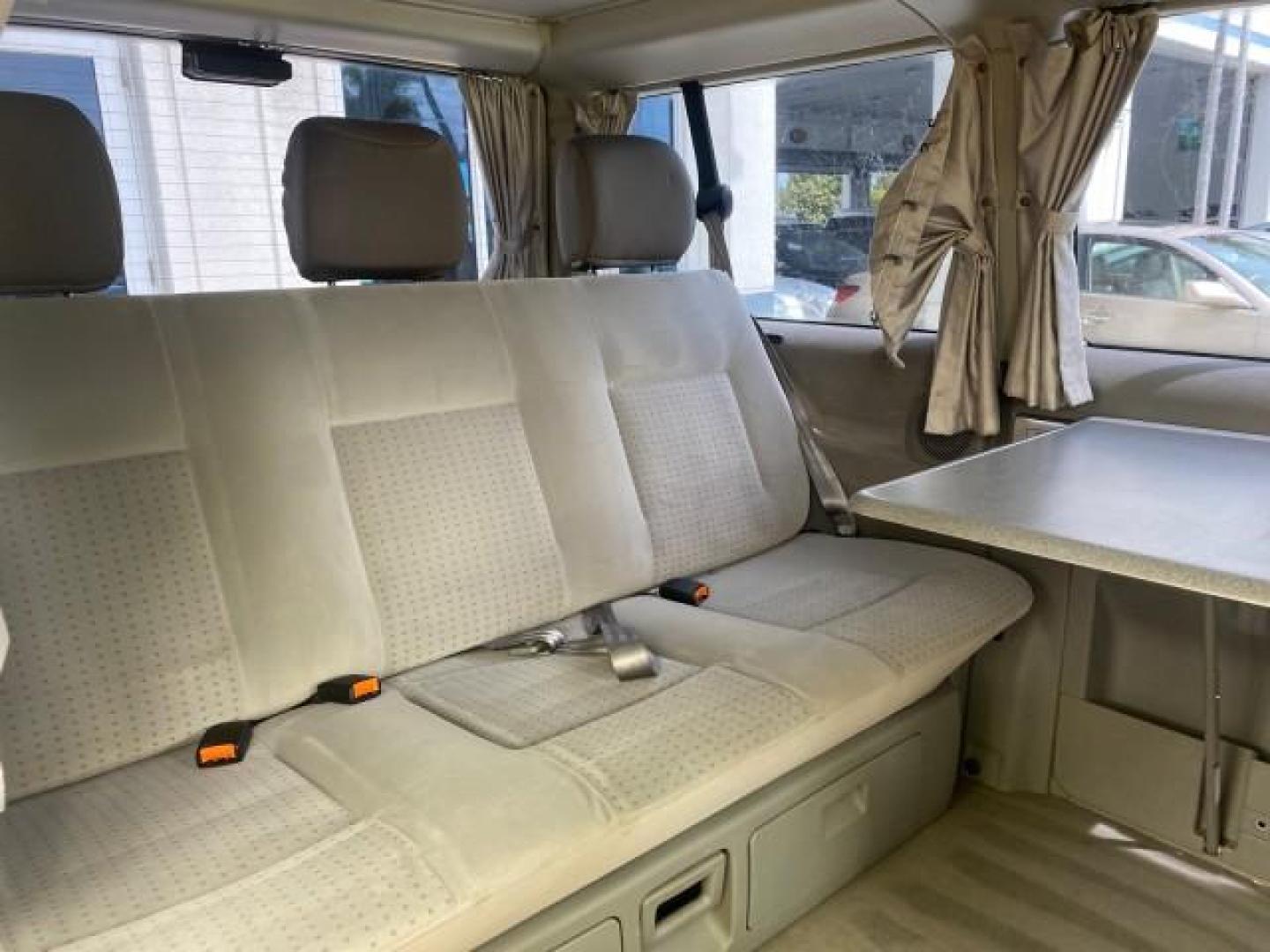 2003 Reflex Silver /Gray Volkswagen EuroVan MV POP UP CAMPER VAN (WV2NB47093H) with an 2.8L DOHC SMPI V6 Engine engine, Automatic transmission, located at 4701 North Dixie Hwy, Pompano Beach, FL, 33064, (954) 422-2889, 26.240938, -80.123474 - OUR WEBPAGE FLORIDACARS1.COM HAS OVER 100 PHOTOS AND FREE CARFAX LINK 2003 Volkswagen Eurovan MV Westfalia Pop Top Camper Van 2.8L I6 F Gasoline 20 MPG Front Wheel Drive Features ABS Brakes Air Conditioning Alloy Wheels AM/FM Stereo Automatic Transmission Cloth Seats Cruise Control Power Locks Power- Photo#85