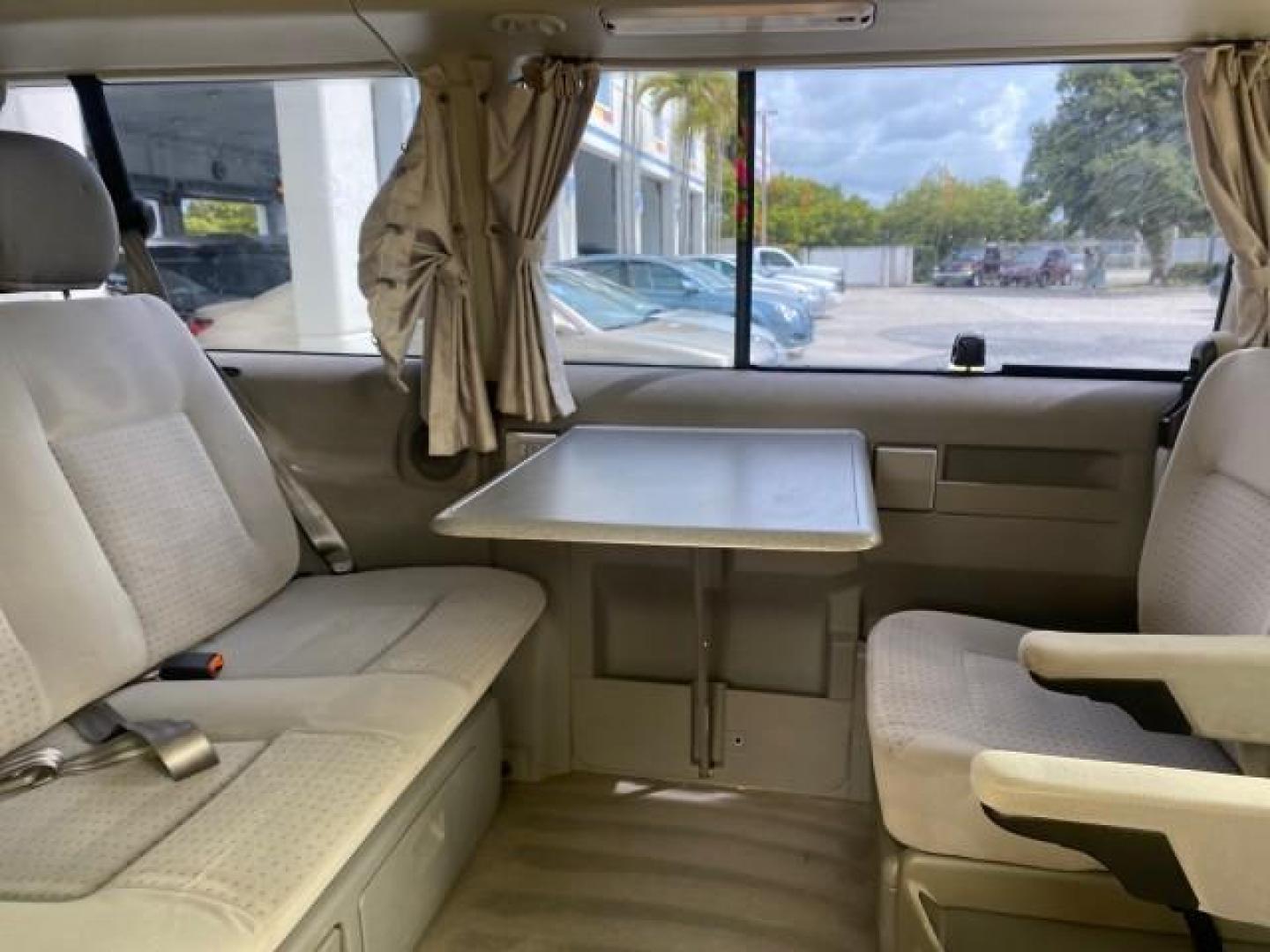 2003 Reflex Silver /Gray Volkswagen EuroVan MV POP UP CAMPER VAN (WV2NB47093H) with an 2.8L DOHC SMPI V6 Engine engine, Automatic transmission, located at 4701 North Dixie Hwy, Pompano Beach, FL, 33064, (954) 422-2889, 26.240938, -80.123474 - OUR WEBPAGE FLORIDACARS1.COM HAS OVER 100 PHOTOS AND FREE CARFAX LINK 2003 Volkswagen Eurovan MV Westfalia Pop Top Camper Van 2.8L I6 F Gasoline 20 MPG Front Wheel Drive Features ABS Brakes Air Conditioning Alloy Wheels AM/FM Stereo Automatic Transmission Cloth Seats Cruise Control Power Locks Power- Photo#86