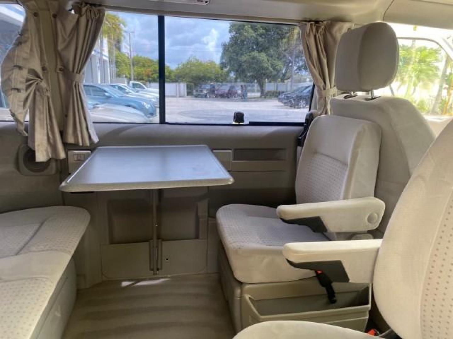 2003 Reflex Silver /Gray Volkswagen EuroVan MV POP UP CAMPER VAN (WV2NB47093H) with an 2.8L DOHC SMPI V6 Engine engine, Automatic transmission, located at 4701 North Dixie Hwy, Pompano Beach, FL, 33064, (954) 422-2889, 26.240938, -80.123474 - OUR WEBPAGE FLORIDACARS1.COM HAS OVER 100 PHOTOS AND FREE CARFAX LINK 2003 Volkswagen Eurovan MV Westfalia Pop Top Camper Van 2.8L I6 F Gasoline 20 MPG Front Wheel Drive Features ABS Brakes Air Conditioning Alloy Wheels AM/FM Stereo Automatic Transmission Cloth Seats Cruise Control Power Locks Power- Photo#87