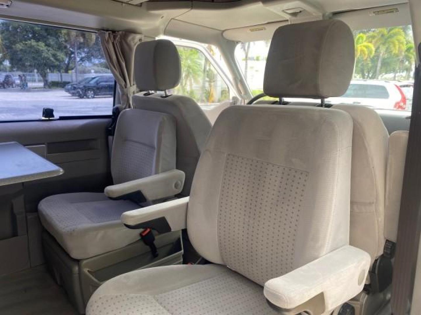 2003 Reflex Silver /Gray Volkswagen EuroVan MV POP UP CAMPER VAN (WV2NB47093H) with an 2.8L DOHC SMPI V6 Engine engine, Automatic transmission, located at 4701 North Dixie Hwy, Pompano Beach, FL, 33064, (954) 422-2889, 26.240938, -80.123474 - OUR WEBPAGE FLORIDACARS1.COM HAS OVER 100 PHOTOS AND FREE CARFAX LINK 2003 Volkswagen Eurovan MV Westfalia Pop Top Camper Van 2.8L I6 F Gasoline 20 MPG Front Wheel Drive Features ABS Brakes Air Conditioning Alloy Wheels AM/FM Stereo Automatic Transmission Cloth Seats Cruise Control Power Locks Power- Photo#88
