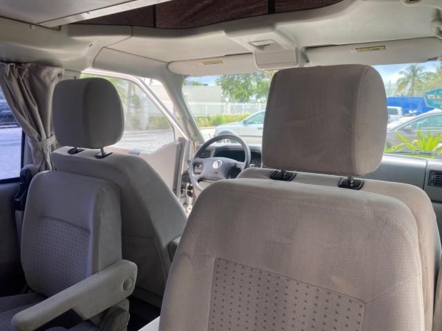 2003 Reflex Silver /Gray Volkswagen EuroVan MV POP UP CAMPER VAN (WV2NB47093H) with an 2.8L DOHC SMPI V6 Engine engine, Automatic transmission, located at 4701 North Dixie Hwy, Pompano Beach, FL, 33064, (954) 422-2889, 26.240938, -80.123474 - OUR WEBPAGE FLORIDACARS1.COM HAS OVER 100 PHOTOS AND FREE CARFAX LINK 2003 Volkswagen Eurovan MV Westfalia Pop Top Camper Van 2.8L I6 F Gasoline 20 MPG Front Wheel Drive Features ABS Brakes Air Conditioning Alloy Wheels AM/FM Stereo Automatic Transmission Cloth Seats Cruise Control Power Locks Power- Photo#89