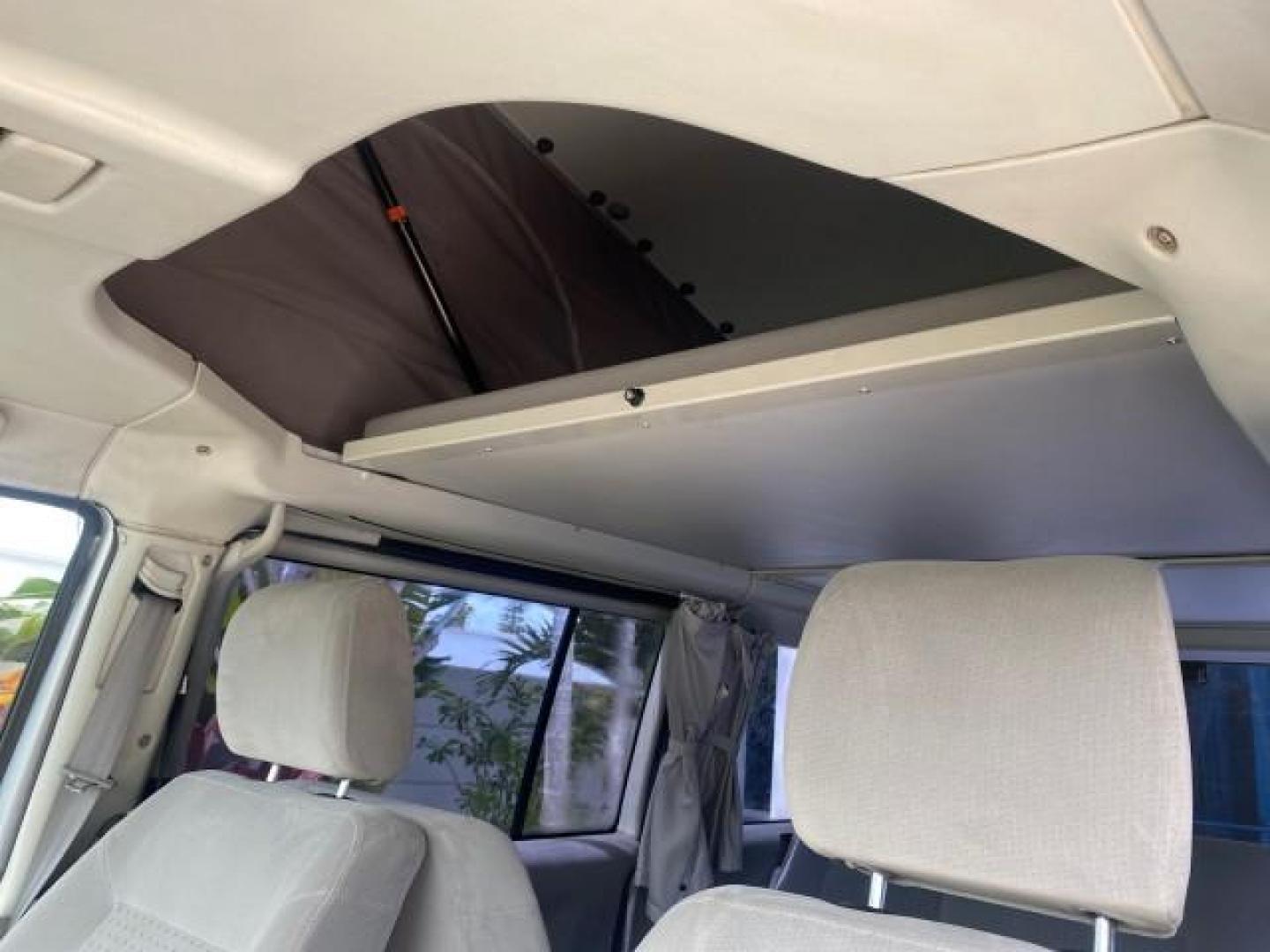 2003 Reflex Silver /Gray Volkswagen EuroVan MV POP UP CAMPER VAN (WV2NB47093H) with an 2.8L DOHC SMPI V6 Engine engine, Automatic transmission, located at 4701 North Dixie Hwy, Pompano Beach, FL, 33064, (954) 422-2889, 26.240938, -80.123474 - OUR WEBPAGE FLORIDACARS1.COM HAS OVER 100 PHOTOS AND FREE CARFAX LINK 2003 Volkswagen Eurovan MV Westfalia Pop Top Camper Van 2.8L I6 F Gasoline 20 MPG Front Wheel Drive Features ABS Brakes Air Conditioning Alloy Wheels AM/FM Stereo Automatic Transmission Cloth Seats Cruise Control Power Locks Power- Photo#90