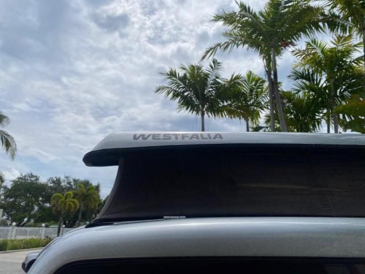 2003 Reflex Silver /Gray Volkswagen EuroVan MV POP UP CAMPER VAN (WV2NB47093H) with an 2.8L DOHC SMPI V6 Engine engine, Automatic transmission, located at 4701 North Dixie Hwy, Pompano Beach, FL, 33064, (954) 422-2889, 26.240938, -80.123474 - OUR WEBPAGE FLORIDACARS1.COM HAS OVER 100 PHOTOS AND FREE CARFAX LINK 2003 Volkswagen Eurovan MV Westfalia Pop Top Camper Van 2.8L I6 F Gasoline 20 MPG Front Wheel Drive Features ABS Brakes Air Conditioning Alloy Wheels AM/FM Stereo Automatic Transmission Cloth Seats Cruise Control Power Locks Power- Photo#96