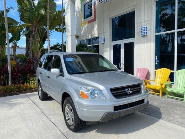2004 Starlight Silver Metallic /Gray Honda Pilot EX-L 4WD LOW MILES 64,262 (2HKYF18574H) with an 3.5L SOHC PGM-FI 24-Valve VTEC V6 Engine engine, Automatic transmission, located at 4701 North Dixie Hwy, Pompano Beach, FL, 33064, (954) 422-2889, 26.240938, -80.123474 - OUR WEBPAGE FLORIDACARS1.COM HAS OVER 100 PHOTOS AND FREE CARFAX LINK 2004 Honda Pilot EX-L 4WD/AWD 4 Door Wagon/Sport Utility 3.5L V6 F SOHC Gasoline 22 MPG All Wheel Drive Features 4WD/AWD ABS Brakes Air Conditioning Alloy Wheels AM/FM Stereo Automatic Transmission Cassette Player CD Audio Cruise- Photo#1