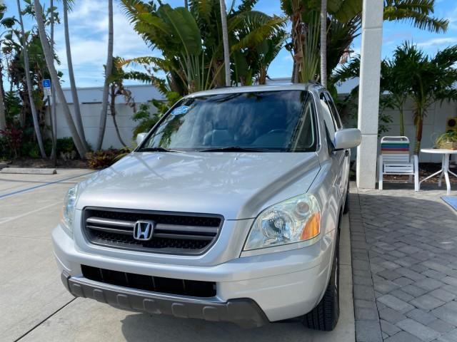 2004 Starlight Silver Metallic /Gray Honda Pilot EX-L 4WD LOW MILES 64,262 (2HKYF18574H) with an 3.5L SOHC PGM-FI 24-Valve VTEC V6 Engine engine, Automatic transmission, located at 4701 North Dixie Hwy, Pompano Beach, FL, 33064, (954) 422-2889, 26.240938, -80.123474 - OUR WEBPAGE FLORIDACARS1.COM HAS OVER 100 PHOTOS AND FREE CARFAX LINK 2004 Honda Pilot EX-L 4WD/AWD 4 Door Wagon/Sport Utility 3.5L V6 F SOHC Gasoline 22 MPG All Wheel Drive Features 4WD/AWD ABS Brakes Air Conditioning Alloy Wheels AM/FM Stereo Automatic Transmission Cassette Player CD Audio Cruise- Photo#3