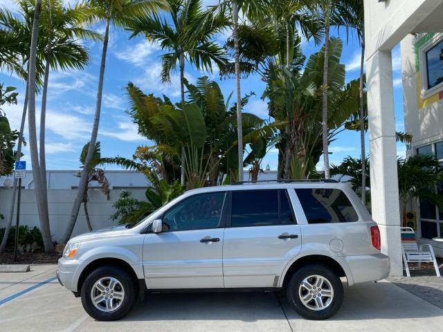2004 Starlight Silver Metallic /Gray Honda Pilot EX-L 4WD LOW MILES 64,262 (2HKYF18574H) with an 3.5L SOHC PGM-FI 24-Valve VTEC V6 Engine engine, Automatic transmission, located at 4701 North Dixie Hwy, Pompano Beach, FL, 33064, (954) 422-2889, 26.240938, -80.123474 - OUR WEBPAGE FLORIDACARS1.COM HAS OVER 100 PHOTOS AND FREE CARFAX LINK 2004 Honda Pilot EX-L 4WD/AWD 4 Door Wagon/Sport Utility 3.5L V6 F SOHC Gasoline 22 MPG All Wheel Drive Features 4WD/AWD ABS Brakes Air Conditioning Alloy Wheels AM/FM Stereo Automatic Transmission Cassette Player CD Audio Cruise- Photo#4