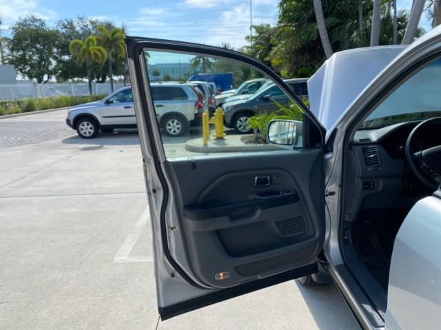 2004 Starlight Silver Metallic /Gray Honda Pilot EX-L 4WD LOW MILES 64,262 (2HKYF18574H) with an 3.5L SOHC PGM-FI 24-Valve VTEC V6 Engine engine, Automatic transmission, located at 4701 North Dixie Hwy, Pompano Beach, FL, 33064, (954) 422-2889, 26.240938, -80.123474 - OUR WEBPAGE FLORIDACARS1.COM HAS OVER 100 PHOTOS AND FREE CARFAX LINK 2004 Honda Pilot EX-L 4WD/AWD 4 Door Wagon/Sport Utility 3.5L V6 F SOHC Gasoline 22 MPG All Wheel Drive Features 4WD/AWD ABS Brakes Air Conditioning Alloy Wheels AM/FM Stereo Automatic Transmission Cassette Player CD Audio Cruise- Photo#9